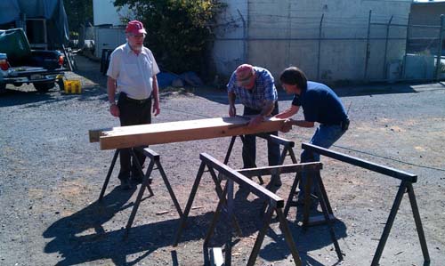 Working on the sides of the transom beams